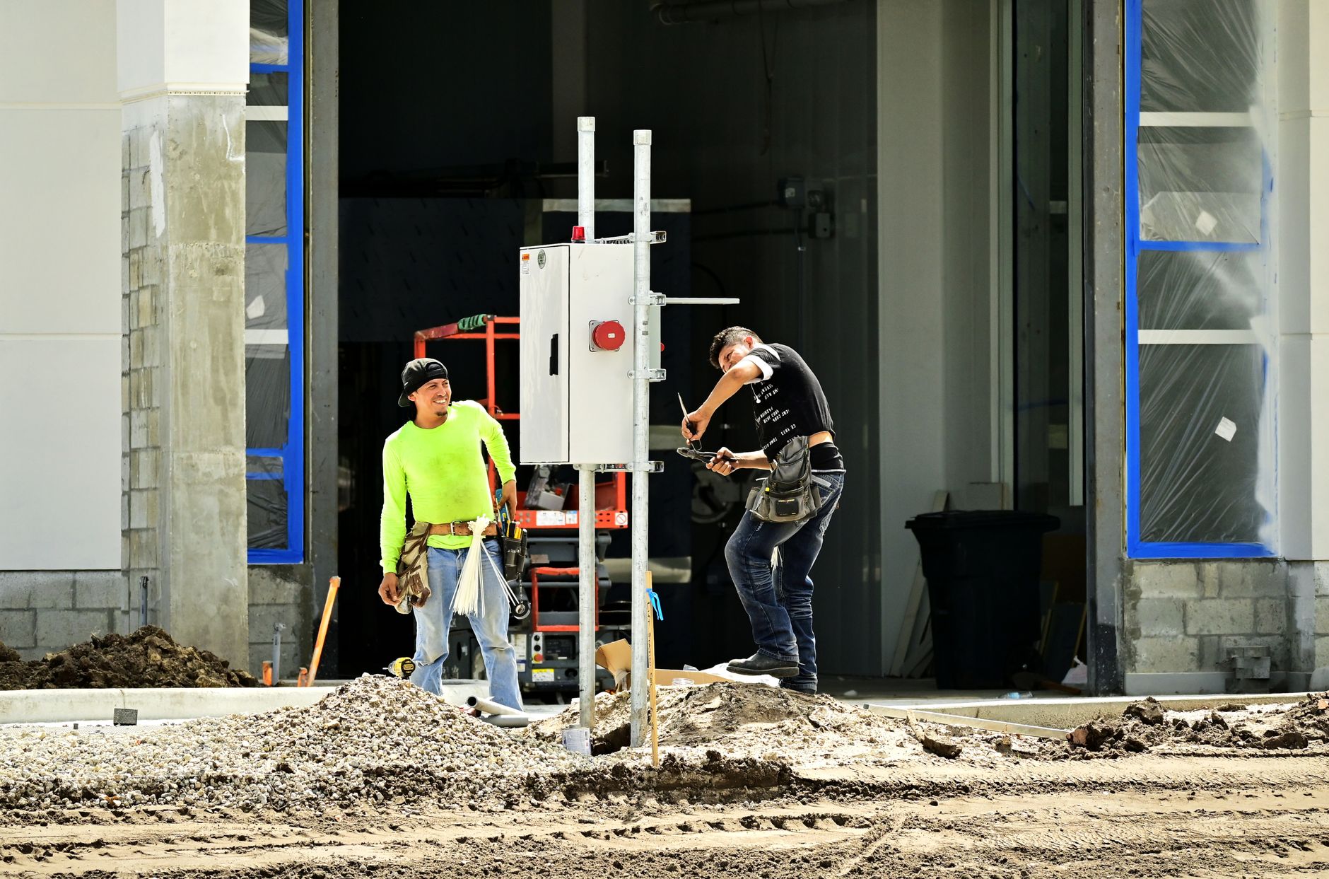 Electrician running conduit in a commercial building