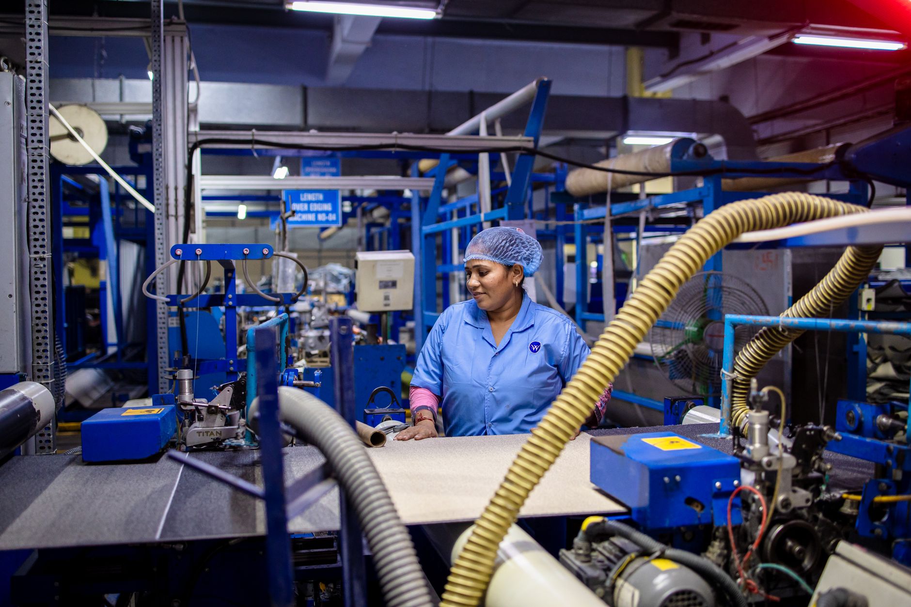 Factory worker at production machinery
