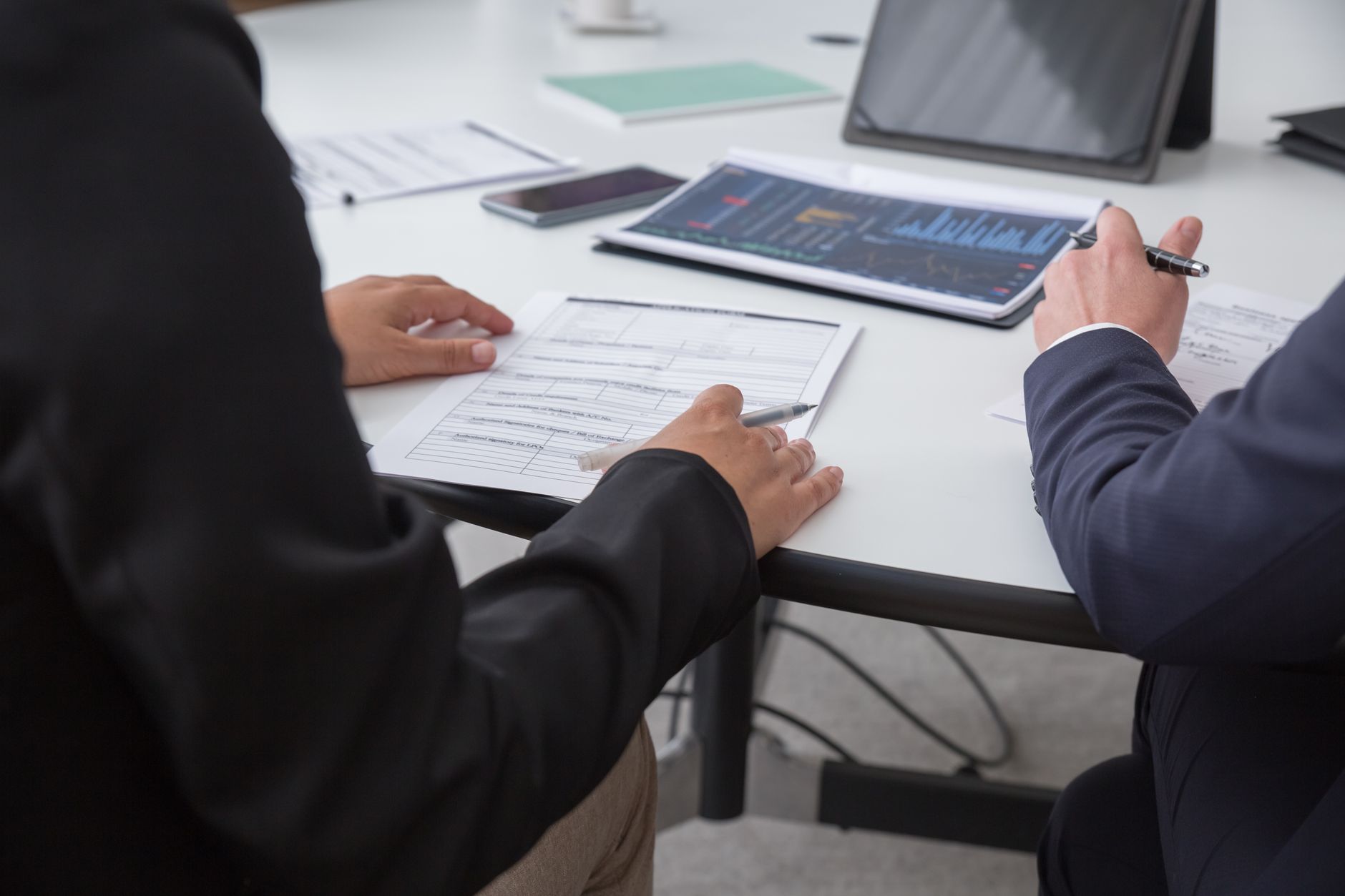 Professionals reviewing documents together in an office