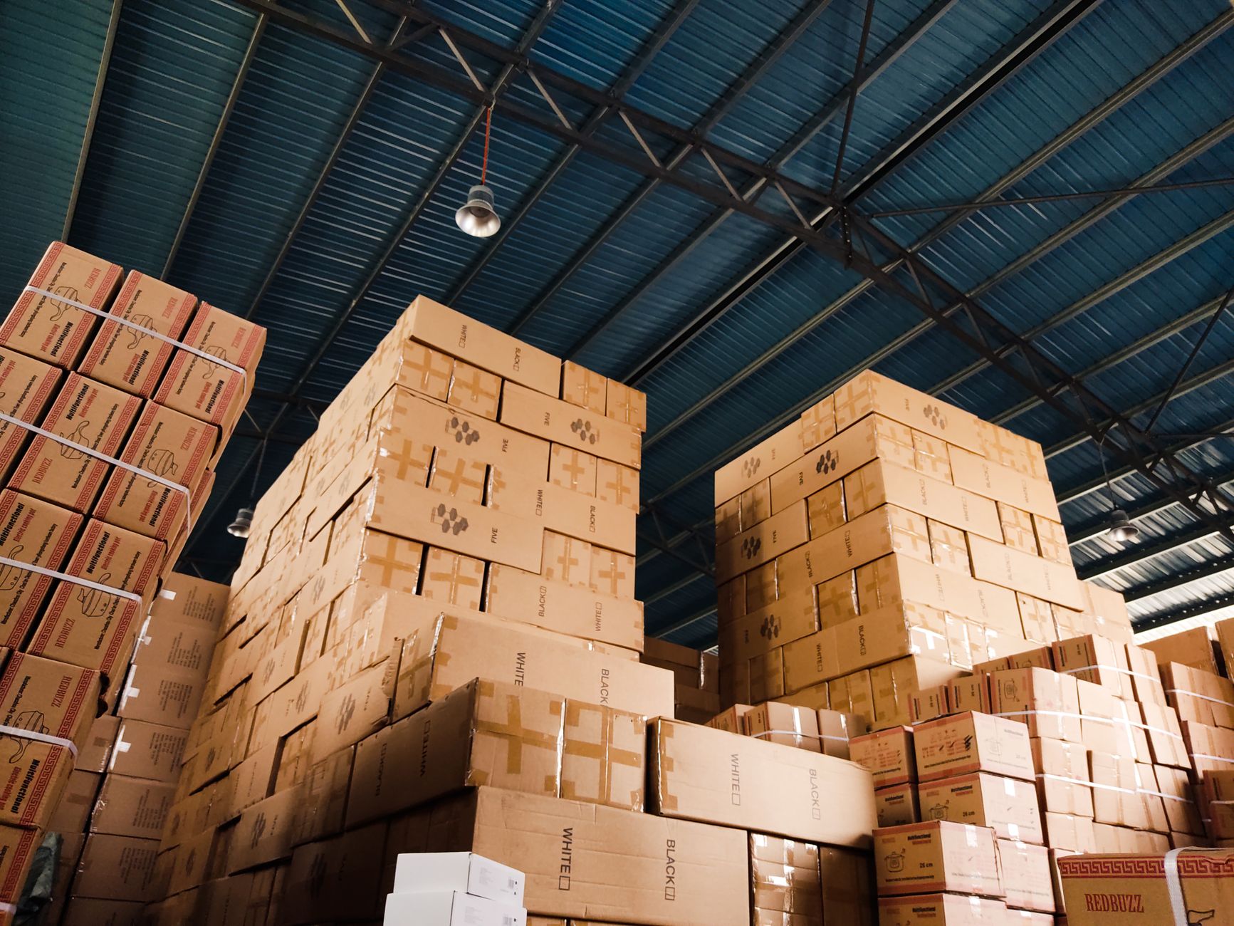 Stacked cardboard shipping boxes in a warehouse