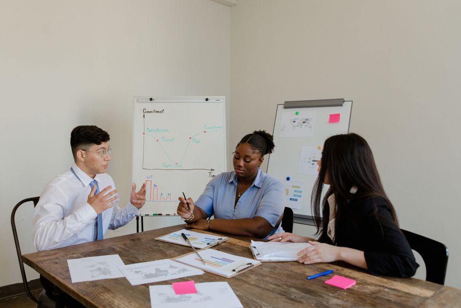 Colleagues reviewing plans in a meeting