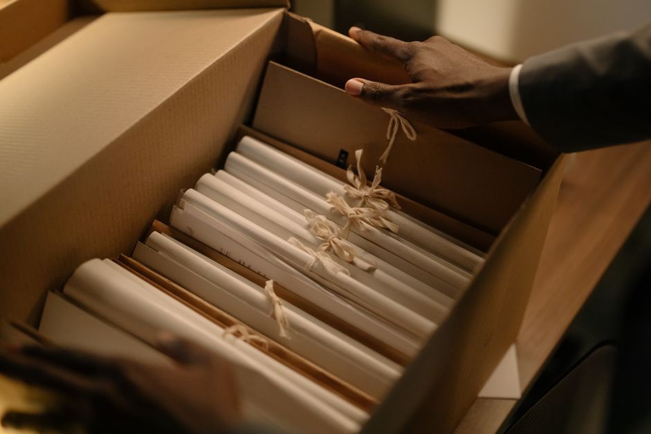Hands organizing business files